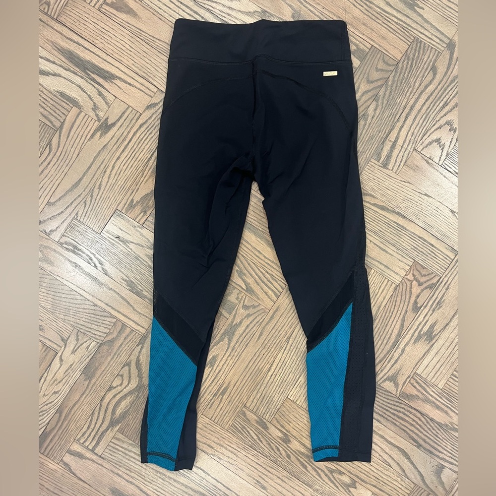 Alala black 3/4 leggings with turquoise mesh detail